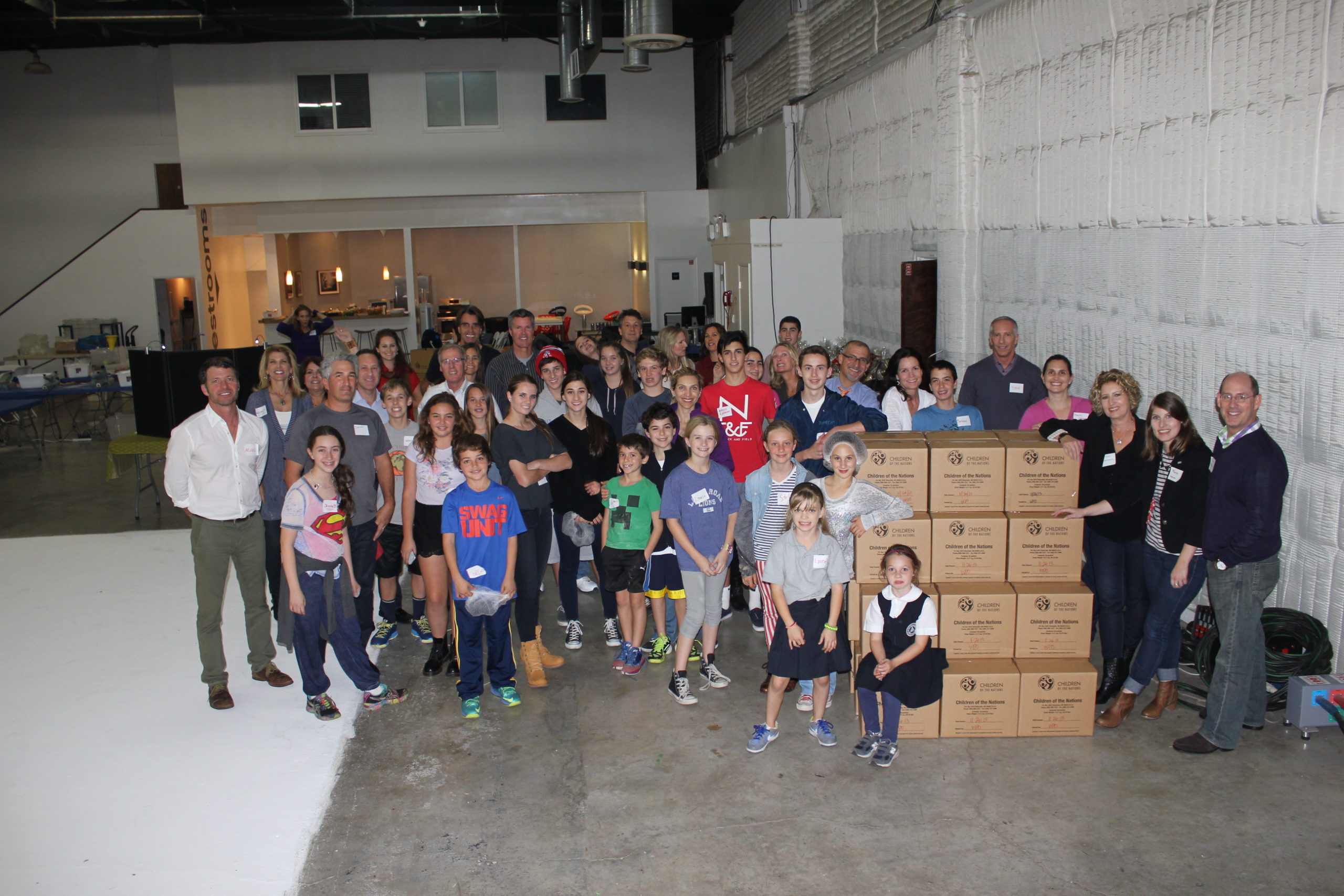 Children of the Nations Packing Meals for 10,000 Families in Need at Quixote Studios